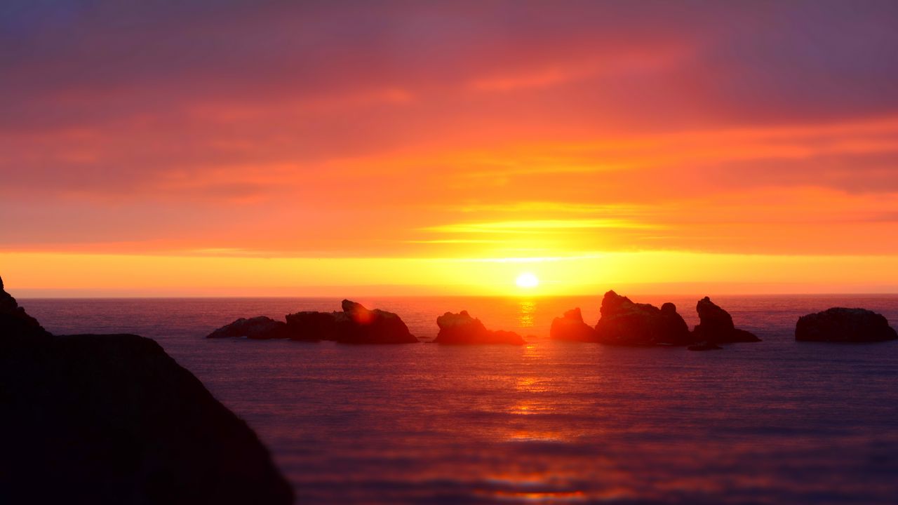 Wallpaper sunset, sun, rocks, horizon, sea