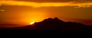 Preview wallpaper sunset, sun, slope, sky, clouds