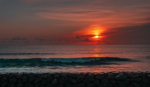 Preview wallpaper sunset, sun, stones, sea, waves