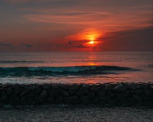 Preview wallpaper sunset, sun, stones, sea, waves