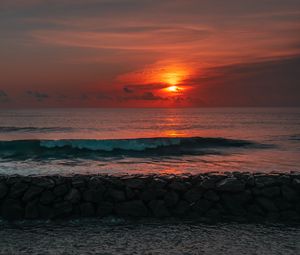 Preview wallpaper sunset, sun, stones, sea, waves