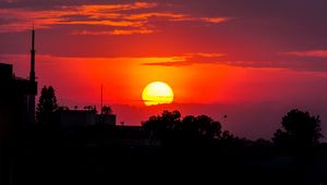 Preview wallpaper sunset, sun, trees, silhouettes, dark