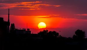 Preview wallpaper sunset, sun, trees, silhouettes, dark