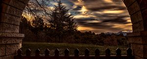 Preview wallpaper sunset, trees, fence, arch