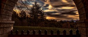 Preview wallpaper sunset, trees, fence, arch