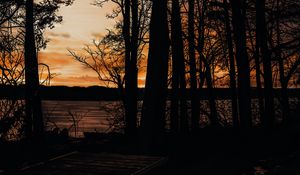 Preview wallpaper sunset, trees, sea, silhouette, pier