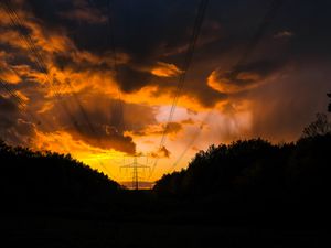 Preview wallpaper sunset, trees, wires, clouds