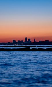 Preview wallpaper sunset, water, city, buildings, silhouettes, dark