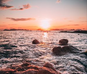 Preview wallpaper sunset, water, stones, waves, coast