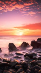 Preview wallpaper sunset, water, stones, fog