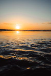 Preview wallpaper sunset, water, waves, sun, dusk