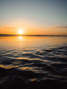 Preview wallpaper sunset, water, waves, sun, dusk