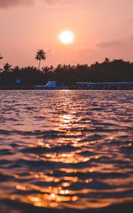 Preview wallpaper sunset, waves, water, boat, palm trees