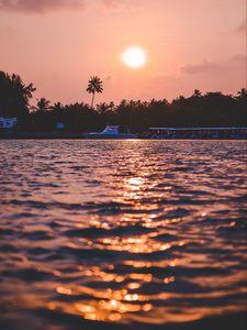 Preview wallpaper sunset, waves, water, boat, palm trees