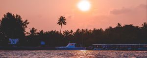 Preview wallpaper sunset, waves, water, boat, palm trees