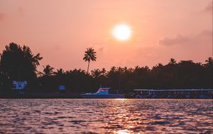 Preview wallpaper sunset, waves, water, boat, palm trees