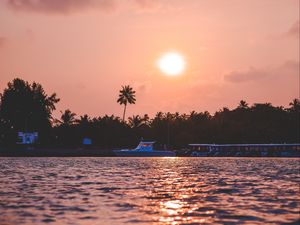 Preview wallpaper sunset, waves, water, boat, palm trees