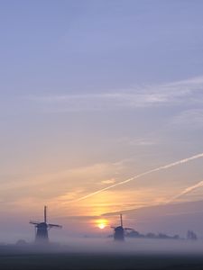 Preview wallpaper sunset, windmills, fog, dusk, landscape