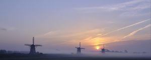 Preview wallpaper sunset, windmills, fog, dusk, landscape