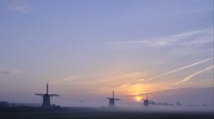 Preview wallpaper sunset, windmills, fog, dusk, landscape