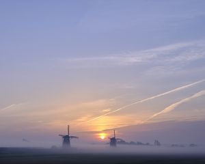 Preview wallpaper sunset, windmills, fog, dusk, landscape