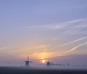 Preview wallpaper sunset, windmills, fog, dusk, landscape