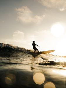 Preview wallpaper surfer, surfing, waves, sunset, glare, bokeh