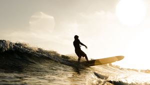 Preview wallpaper surfer, surfing, waves, sunset, glare, bokeh