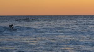 Preview wallpaper surfer, surfing, waves, ocean, sunset, dusk