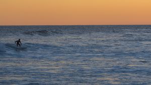 Preview wallpaper surfer, surfing, waves, ocean, sunset, dusk