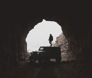 Preview wallpaper suv, jeep, tunnel, silhouette, man
