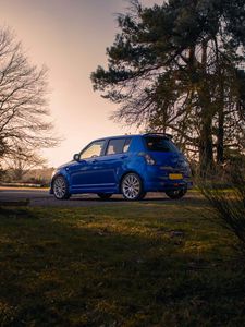 Preview wallpaper suzuki, car, blue, park, trees