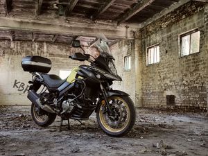 Preview wallpaper suzuki, motorcycle, bike, black, building, ruins