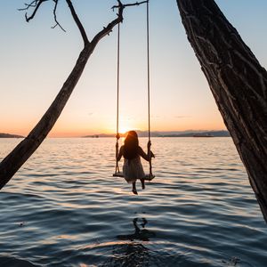 Preview wallpaper swing, girl, sunset, lake, river