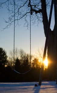 Preview wallpaper swing, winter, sunset, tree, blur