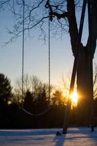 Preview wallpaper swing, winter, sunset, tree, blur