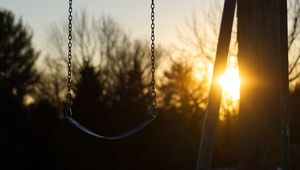 Preview wallpaper swing, winter, sunset, tree, blur