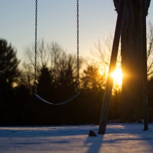 Preview wallpaper swing, winter, sunset, tree, blur