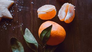 Preview wallpaper tangerine, fruit, slices, leaves, citrus