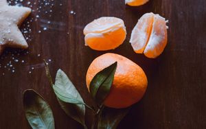 Preview wallpaper tangerine, fruit, slices, leaves, citrus