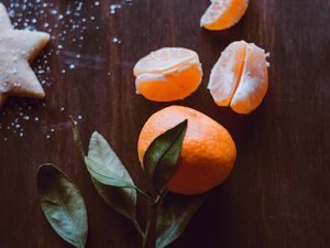 Preview wallpaper tangerine, fruit, slices, leaves, citrus