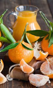 Preview wallpaper tangerines, fruit, citrus fruit, leaves, peels, cloves, juice, pitcher, decanter, board, scissors, tableware