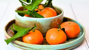 Preview wallpaper tangerines, fruits, citrus, leaves, plates