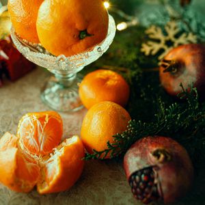 Preview wallpaper tangerines, pomegranate, fruit, branch, thuja