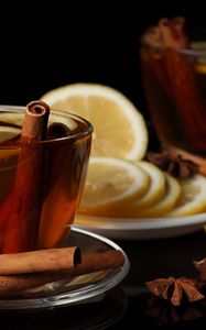 Preview wallpaper tea, cup, cinnamon, lemon, black background