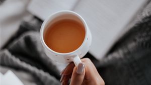 Preview wallpaper tea, cup, hand, book, reading