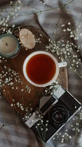 Preview wallpaper tea, mug, camera, candle, flowers, still life