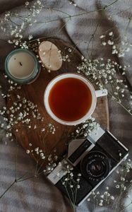 Preview wallpaper tea, mug, camera, candle, flowers, still life