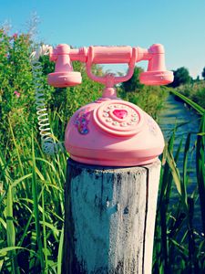 Preview wallpaper telephone, toy, grass, river, trees