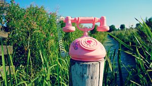 Preview wallpaper telephone, toy, grass, river, trees